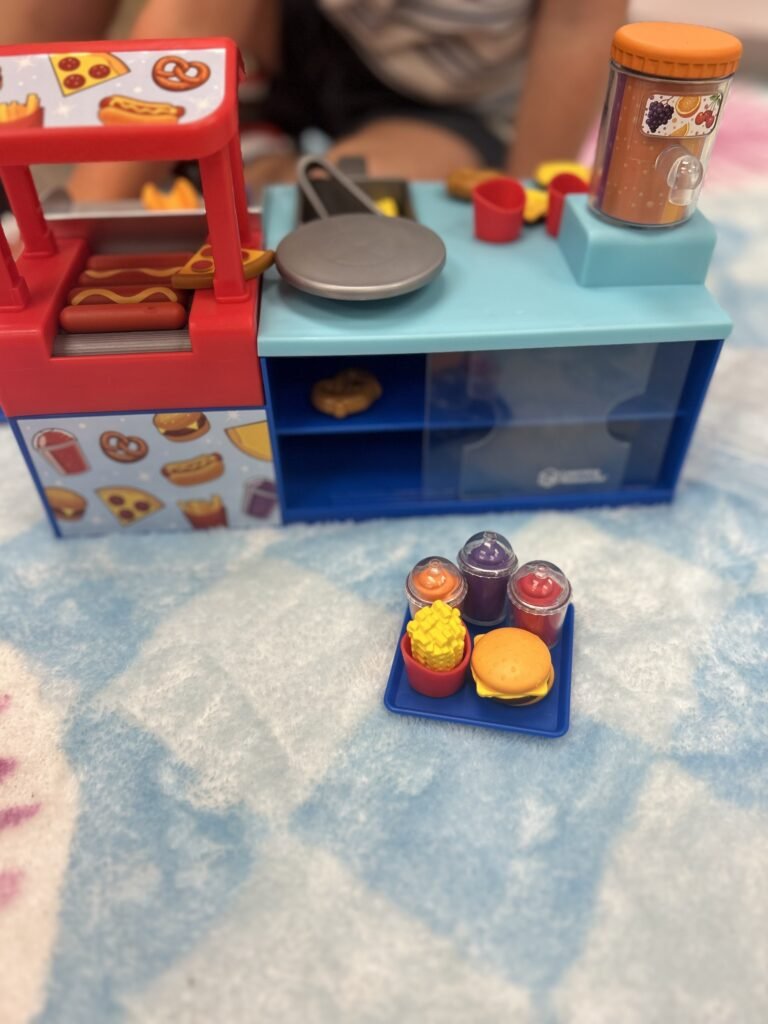 Mini snack shop toy with pretend food and drinks.